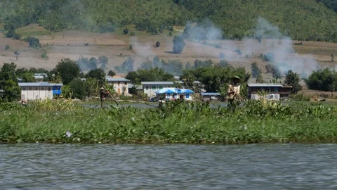 Men working in Burmese floating gardens, Asia in HD Slow motion Stock Footage 95212357