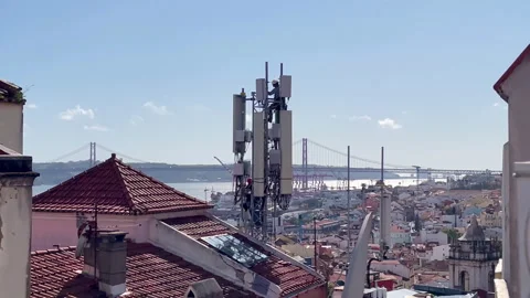 Men Working on Communication Tower, Rooftop View Over Lisbon Video stock 317075073