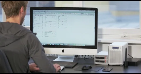 Men working on computer Stock Footage 83125704