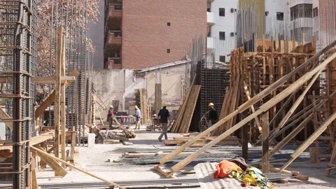  men working on the construction of a building Stock Footage 123799629