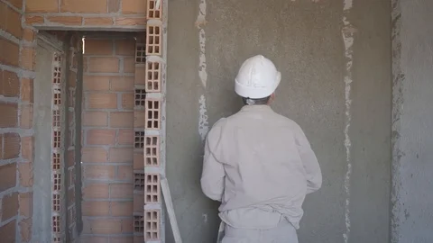  men working on the construction of a building Stock Footage 123799642