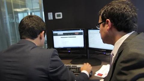 Men working at desks Video stock 77051714