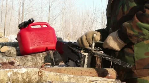 Men working at forest in winter, chainsaw repair Stock Footage 10835552