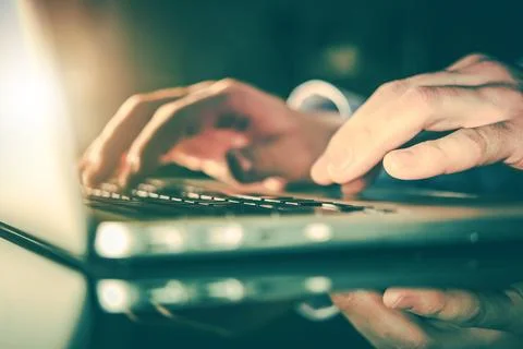 Men Working on Laptop Computer Stock Photos