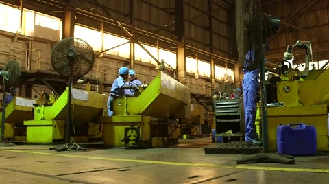 Men Working On A Machine In Workshop Stock Footage 63989823