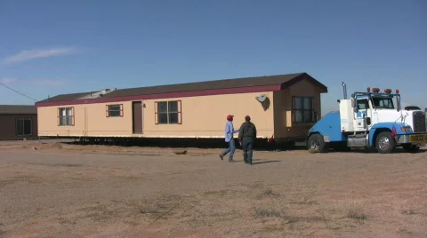 Men Working to Move a House Trailer Stock Footage 560606