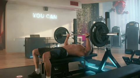 Men working out their arms on machines laying Stockbeeldmateriaal 239553023