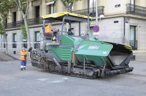 Men working on the pavement Stock Photos