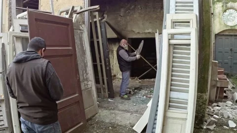 Men Working at Ruins Of Abandoned Building While Wearing a Medical Masks Stock Footage 143190037