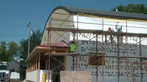 Men Working on Scaffolding - Pan Left to Right Stock Footage 12600391