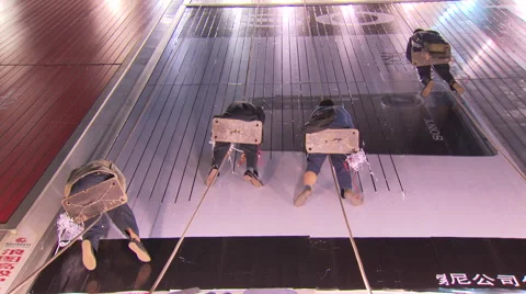 Men working on side of building in harnesses Stock Footage 52949078