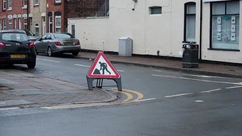 Men working sign on the road. Stock Footage 229174732