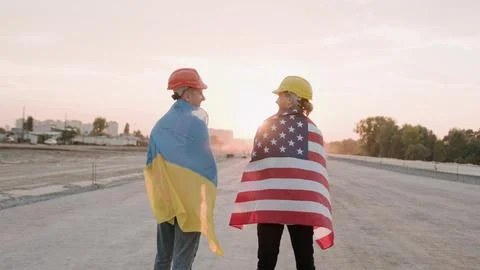Men working on site, cooperation between Ukraine and America Stock Photos