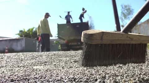Men working on street paving Stock Footage 12652954