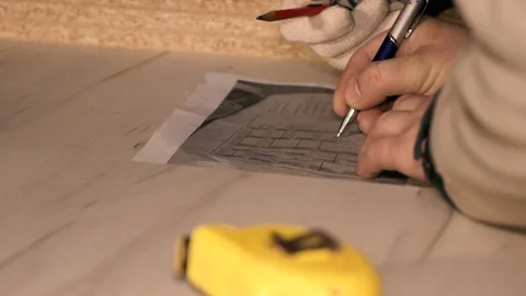 Men in the workplace. Discuss an action plan. Holding a measuring tape Stock Footage 125425885