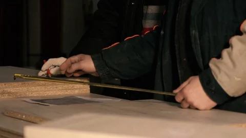 Men in the workplace. Discuss an action plan. Holding a measuring tape Stock Footage 125425980