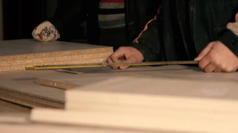 Men in the workplace. Discuss an action plan. Holding a measuring tape Stock Footage 125426059