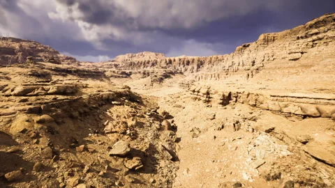 Menacing cloud formation casting shadows on steep cliff faces Stock Footage 340659210