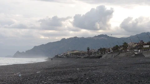 Menacing clouds on the wind-blown beach Stock Footage 97781674