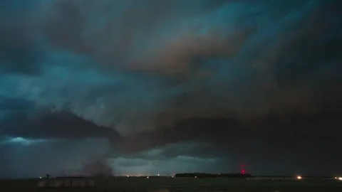 Menacing dark storm clouds move across ominous night sky Stock Footage 338172847