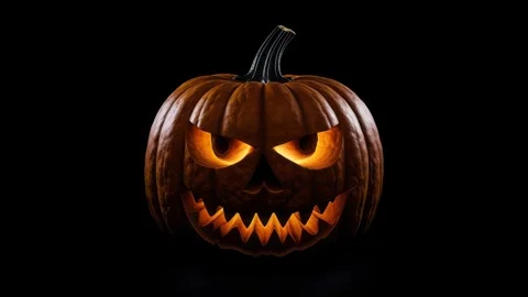 Menacing jack-o’-lantern glows on black Video stock 317167440