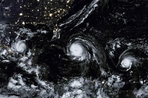 A Menacing Line of Hurricanes. Elements of this image are furnished by NAS... Фото