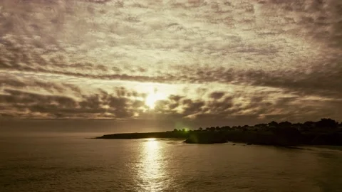 Mendocino Bay Sunset Sun Rays &amp; Gray Fast Moving Clouds over the Ocean Timelapse Stock-Footage 201029325
