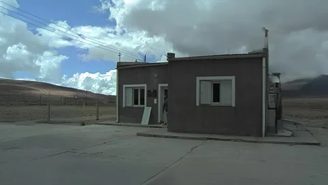 Mendoza, Argentina – 2024, Dec 20: Man leaving small rural house Stock Footage 341971653