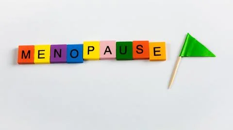 Menopause text in letter blocks with flag Stock Photos