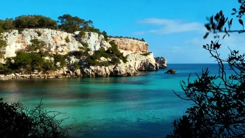 Menorca, Cala Macarella, sea in several blue turquoise shades and cliffs Stock Footage 73608272