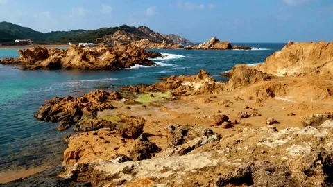 Menorca, Minorca, rock formation in typical colors, Cala de Pregonda Stock Footage 73107603