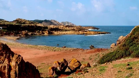 Menorca, Minorca, typical red sand coloring the Cala de Pregonda Stock Footage 73107570