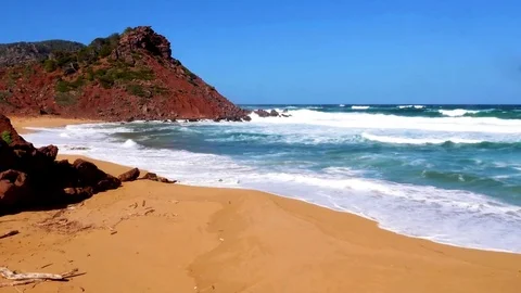 Menorca, waves coming to the empty beach of Cala Pilar, Spain Stock Footage 73620233