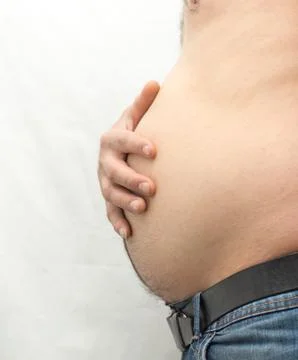 Men's big stomach on white Stock Photos