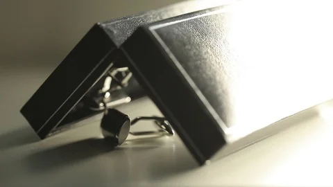 Men's cufflinks for a shirton on the table Macro slider closeup Stock Footage 93761578