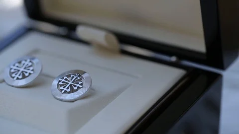 Men's cufflinks for a shirton on the table Macro slider closeup 動画素材 93840544