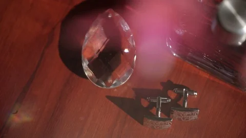 Men's cufflinks for a shirton on the table Macro slider closeup Video stock 95046893