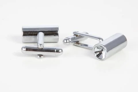 Men's cufflinks on white background. Stock Photos