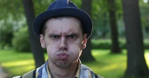 Men's emotions on the background of the park. Affectation. Stock Footage 52453683