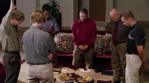Men's group praying, standing in a circle with bowed heads Stock Footage 59537014