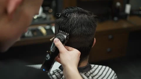 Men's haircut with the help of a machine Stock Footage 245423828