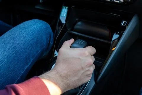 Men's Hand Changing Gear While Driving Car Stock Photos