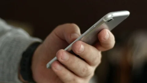 Men's Hand With Digital Clock Dials A Cell Phone Text Stock Footage 72865095