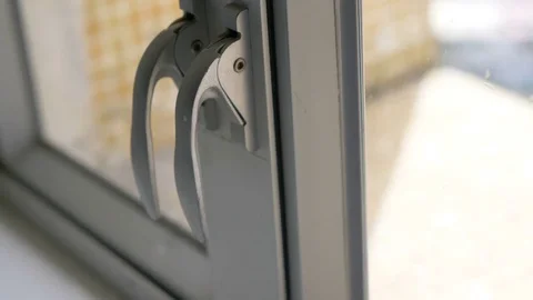 Men's hand opening and closing a window Stock Footage 81055078