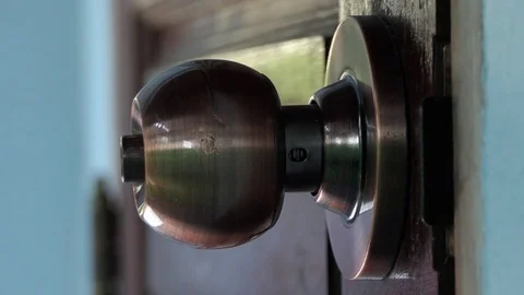 Men's hand opens and closes the brass door knobs.4k video 動画素材 82436063