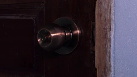 Men's Hand Opens And Closes The Brass Door Knobs.4K Video Stock Footage 108680320