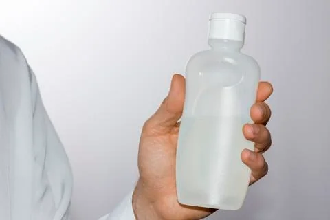 Men's hand with a plastic bottle Stock Photos
