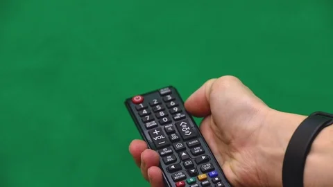 Men's hand. Remote control. Right hand. Green screen. Press the button. 動画素材 103177316