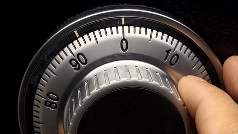 Men's hand is searching for a safe code. Stock-Footage 93436043