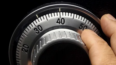 Men's hand is searching for a safe code. Видео 93449118